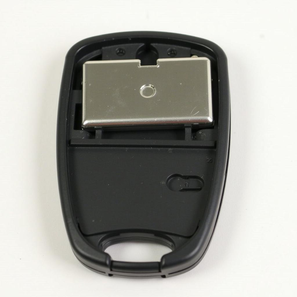 Open key fob of a 2014 Mercedes GLK350 showing battery compartment