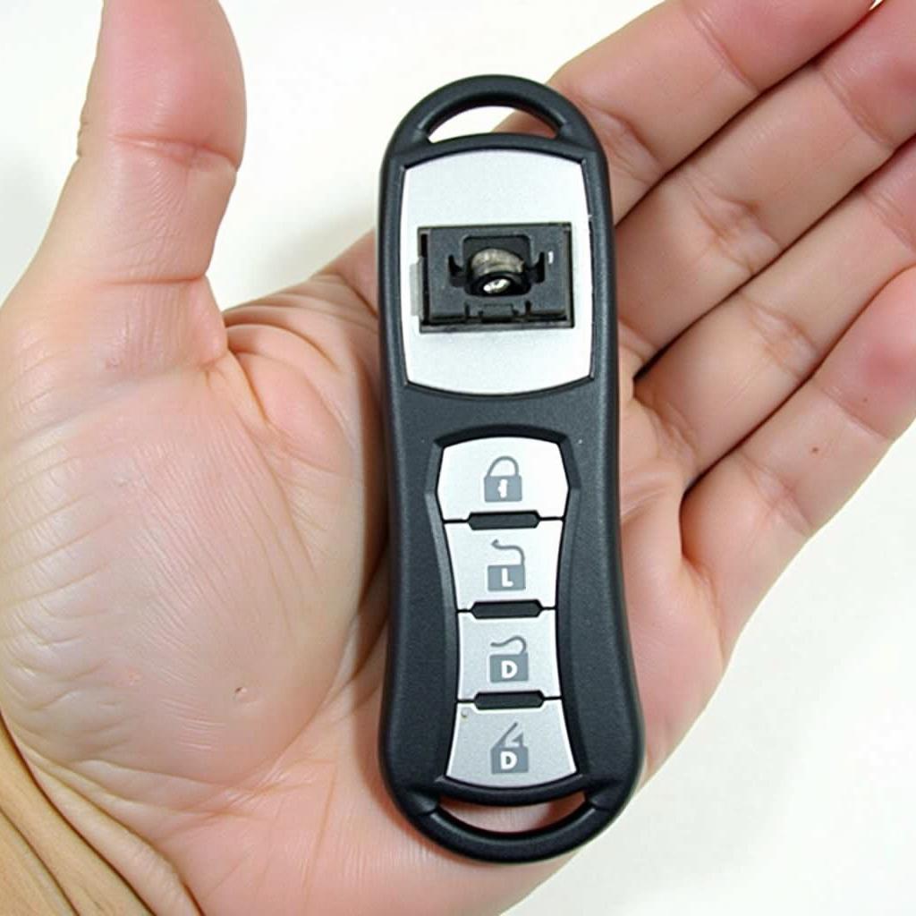 A 2009 Subaru Outback key fob with a new battery installed, fully functional