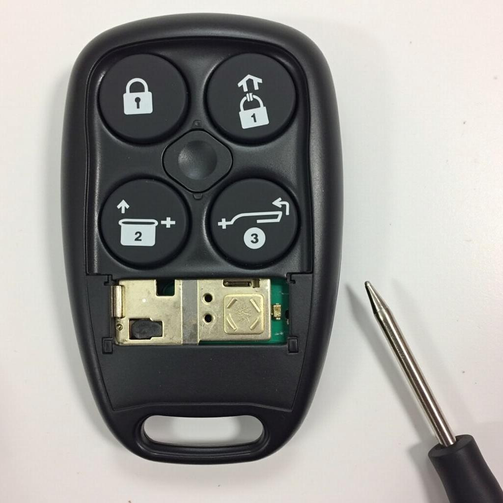 Repairing a Jeep Renegade key fob, highlighting internal components.