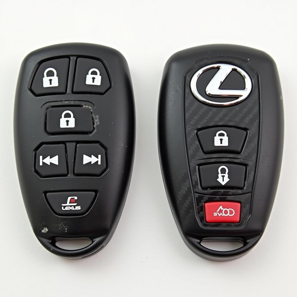 Comparison of a standard Lexus key fob and a Lexus carbon fiber key fob, highlighting the difference in material and aesthetic.