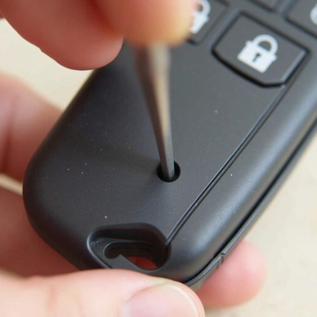 Opening the 2015 GMC Key Fob Case with a Flathead Screwdriver