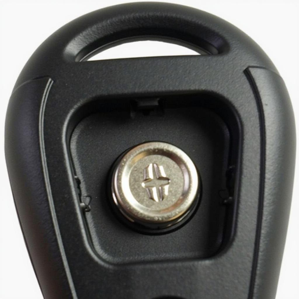 Identifying the battery location inside a 2014 Ford Edge key fob.