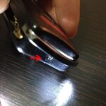 Removing the screw from the Acura TL key fob