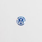 Genuine Volkswagen key fob emblem showcasing the iconic VW logo.