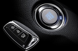 Close-up of a Hyundai key fob next to the ignition, illustrating the process of Hyundai key fob programming after battery replacement.