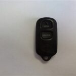 Front view of a 2005 Toyota Highlander key fob with three buttons: lock, unlock, and panic.