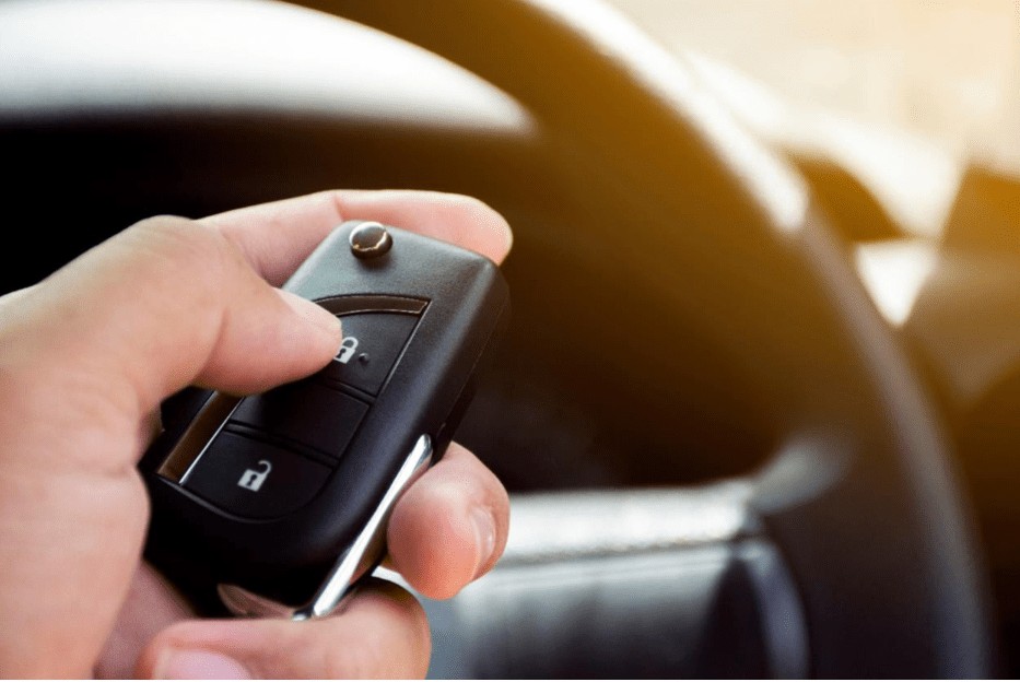 Locate the programming button inside your Toyota vehicle to initiate key fob programming for push-to-start functionality. This button is often found in the transmitter compartment, typically on the driver's side door or under the armrest.