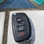 Broken Hyundai Sonata key fob casing with disintegrated buttons.