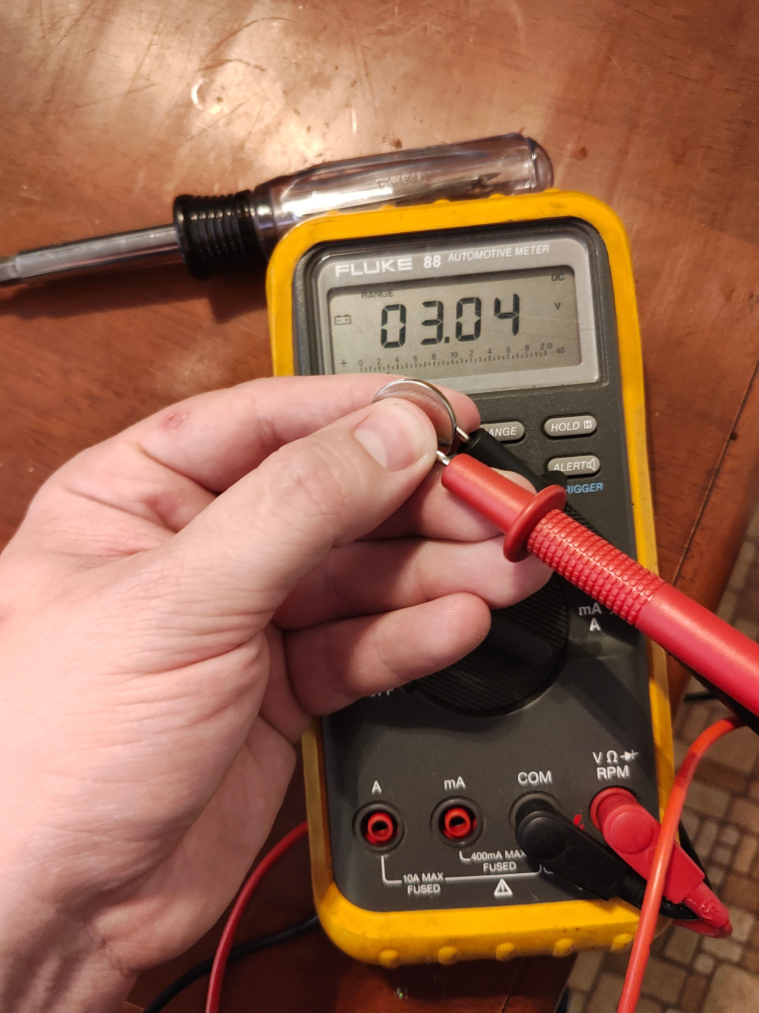 Testing key fob battery with multimeter