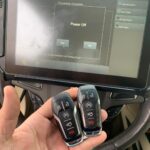 Options for Kia key fob replacement including online retailers, locksmiths, and dealerships.