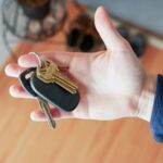 Hand holding a traditional, disorganized keychain