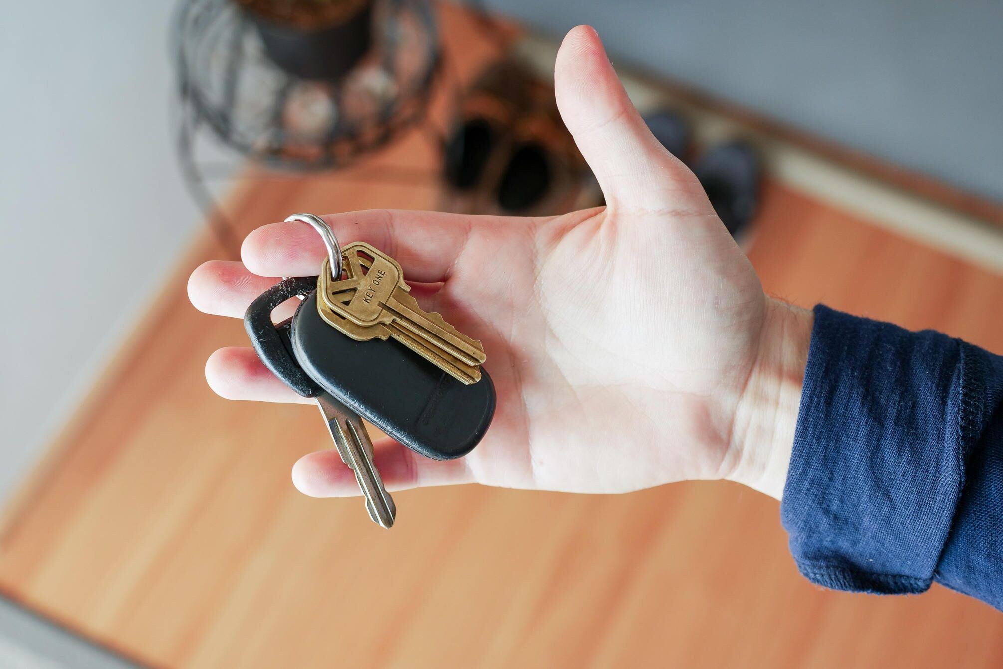 Hand holding a traditional, disorganized keychain