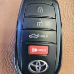 Toyota Tundra key fob experiencing intermittent connectivity issues, preventing door locking and unlocking.