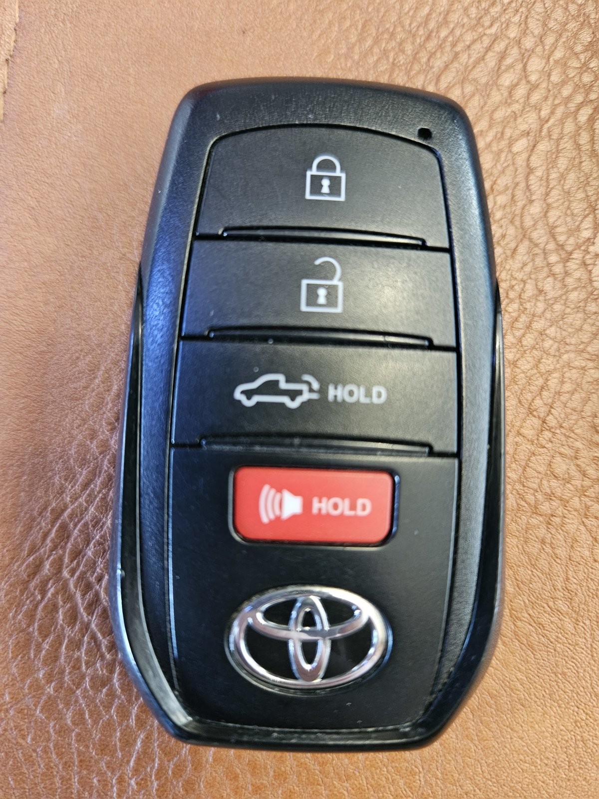 Toyota Tundra key fob experiencing intermittent connectivity issues, preventing door locking and unlocking.