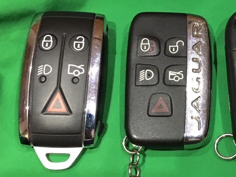 Jaguar XF key fobs comparison. The fob on the left is for models up to 2012, relevant to 2011 Jaguar XF key fob battery replacement. The fob on the right is for 2013 onward models.