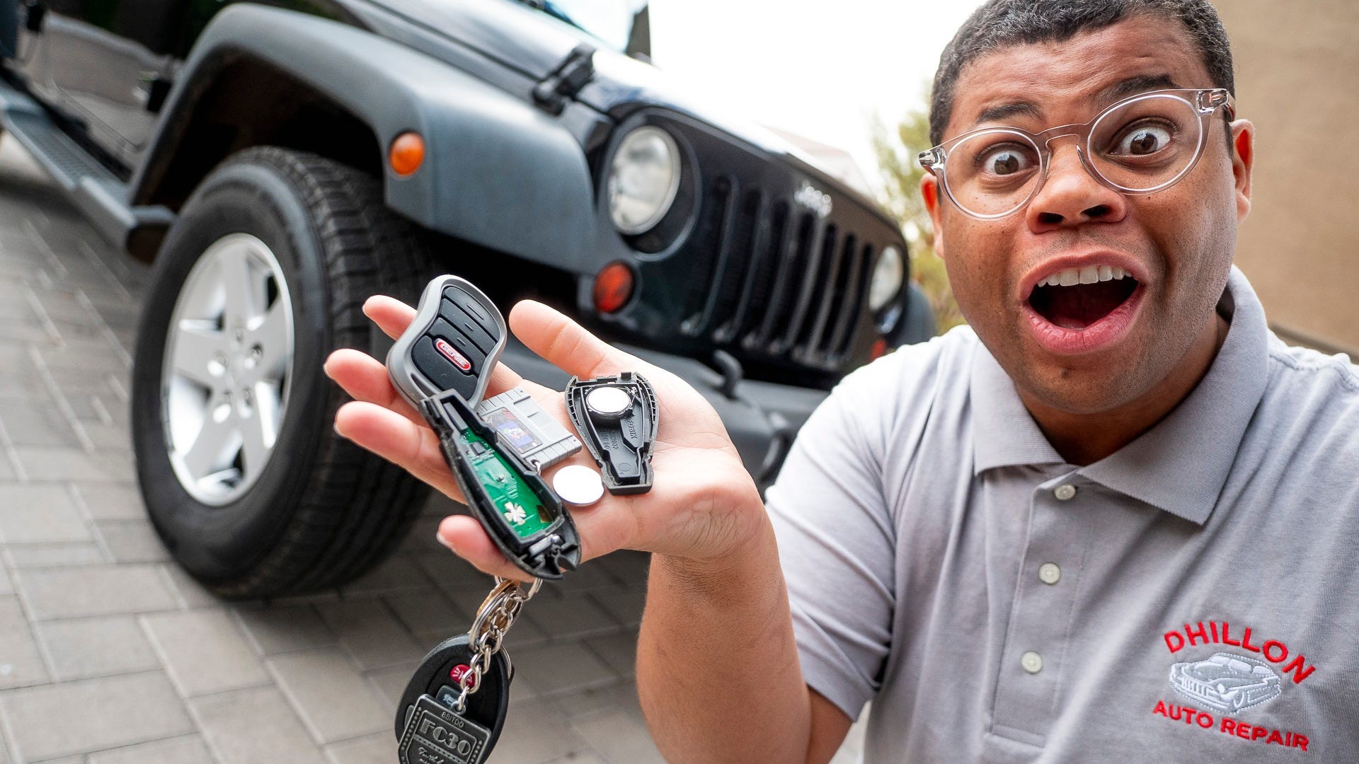 Hands opening a car key fob to access and replace the dead battery. Follow these simple steps to change your key fob battery at home.