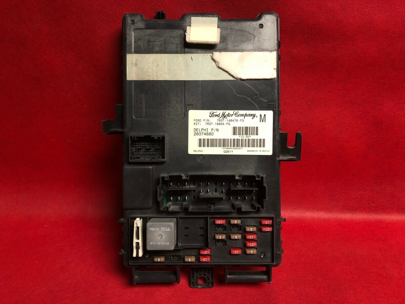 Used Smart Junction Box (SJB) for a Ford Mustang.  A potential component that may need reprogramming or replacement if experiencing 2009 Ford Mustang key fob issues.